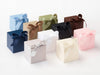 Assorted small softboxes boxes with ribbons on a white background