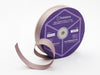 A roll of Ginger Snap colored Grosgrain ribbon on a spool with branding label