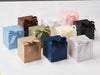 Assorted colorful soft box gift boxes with ribbons on a white background