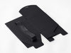 Black large softbox with ribbons on a white background