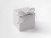 Cloud Grey softbox with a bow on a white background