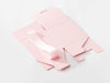 Pink soft box sample folded flat with ribbon on a white background