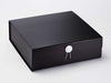 White Facet Gift Box Closure on Large Black Gift Box