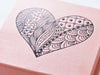 Example of rose gold gift box with black foil printed heart design