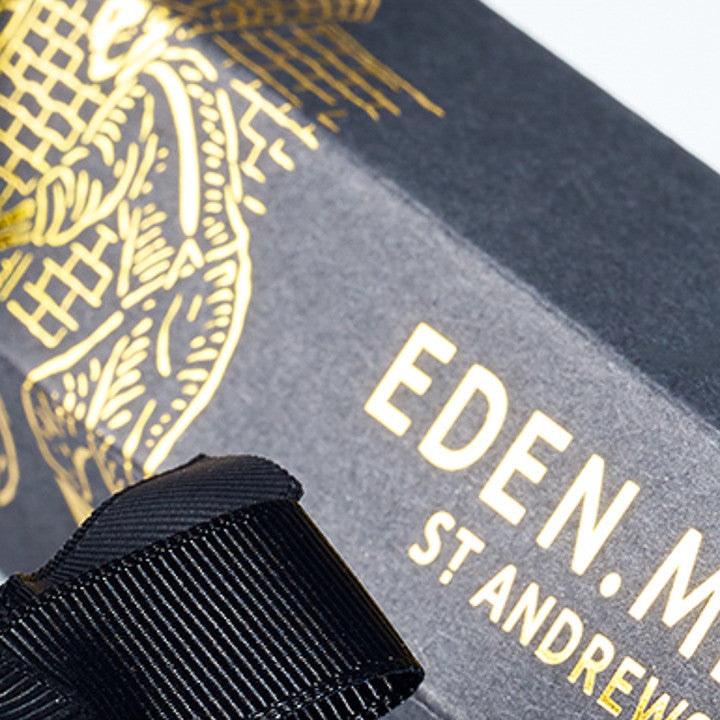 Black Kraft Board Printed with Gold Hot Foil Stamped Design and Logo 