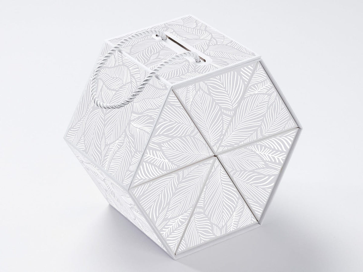 White geometric-patterned box on a light gray background