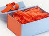 Orange FAB Sides® Featured on Pale Blue Gift Box with Orange Tissue Paper and Russet Orange Ribbon