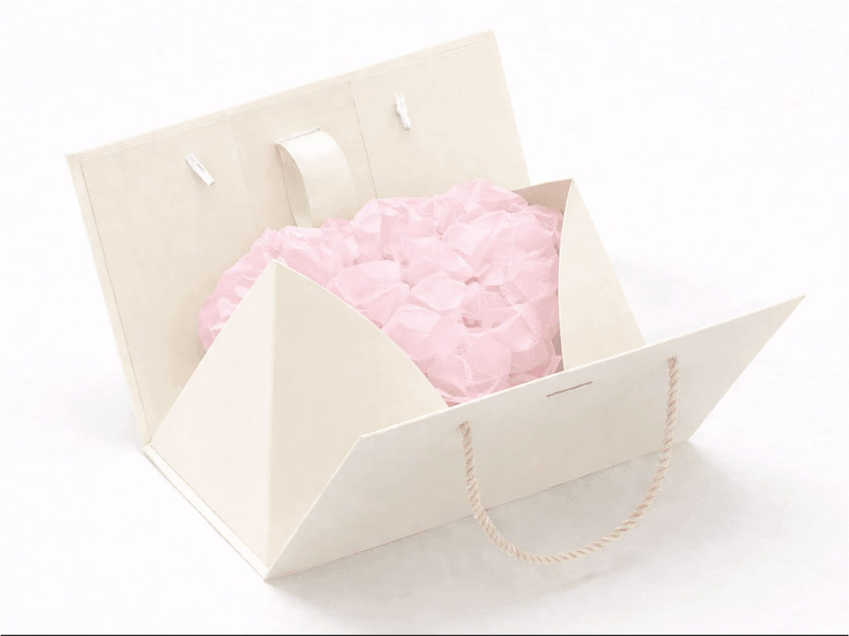 Powder Pink Tissue Paper inside an Ivory Boxbag on a white background