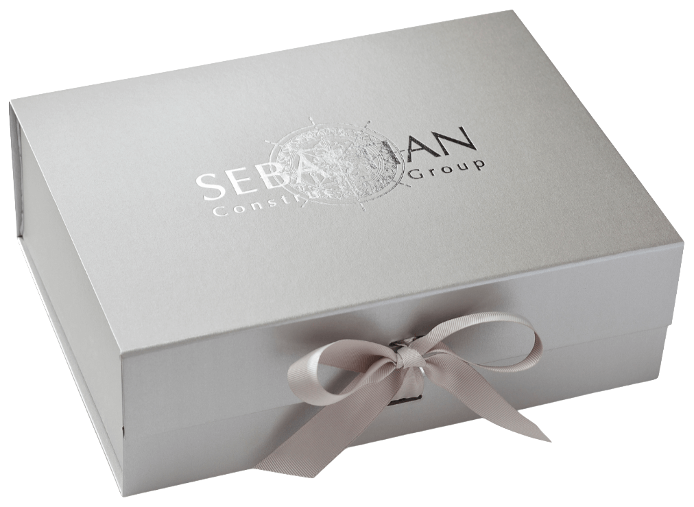 Silver gift box with a ribbon and 'Sebastian' branding on a white background