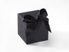 Black gift box with a black ribbon on a white background