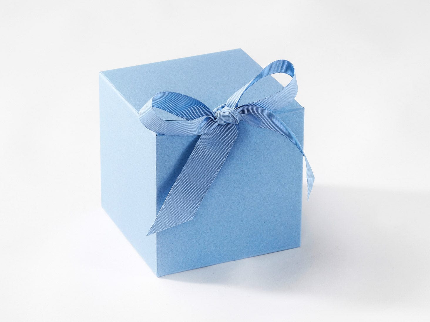 Dusky Blue Softbox gift box with a ribbon on a white background