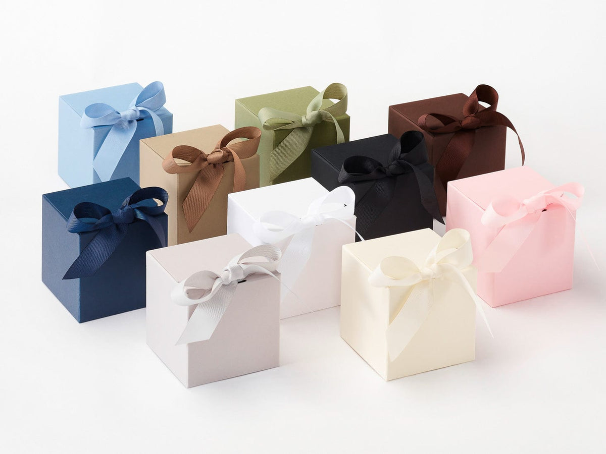 Assorted small Softboxes with ribbons on a white background