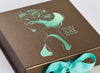 Bronze Folding Gift Box with Aqua Green Foil Logo and Tropic Ribbon